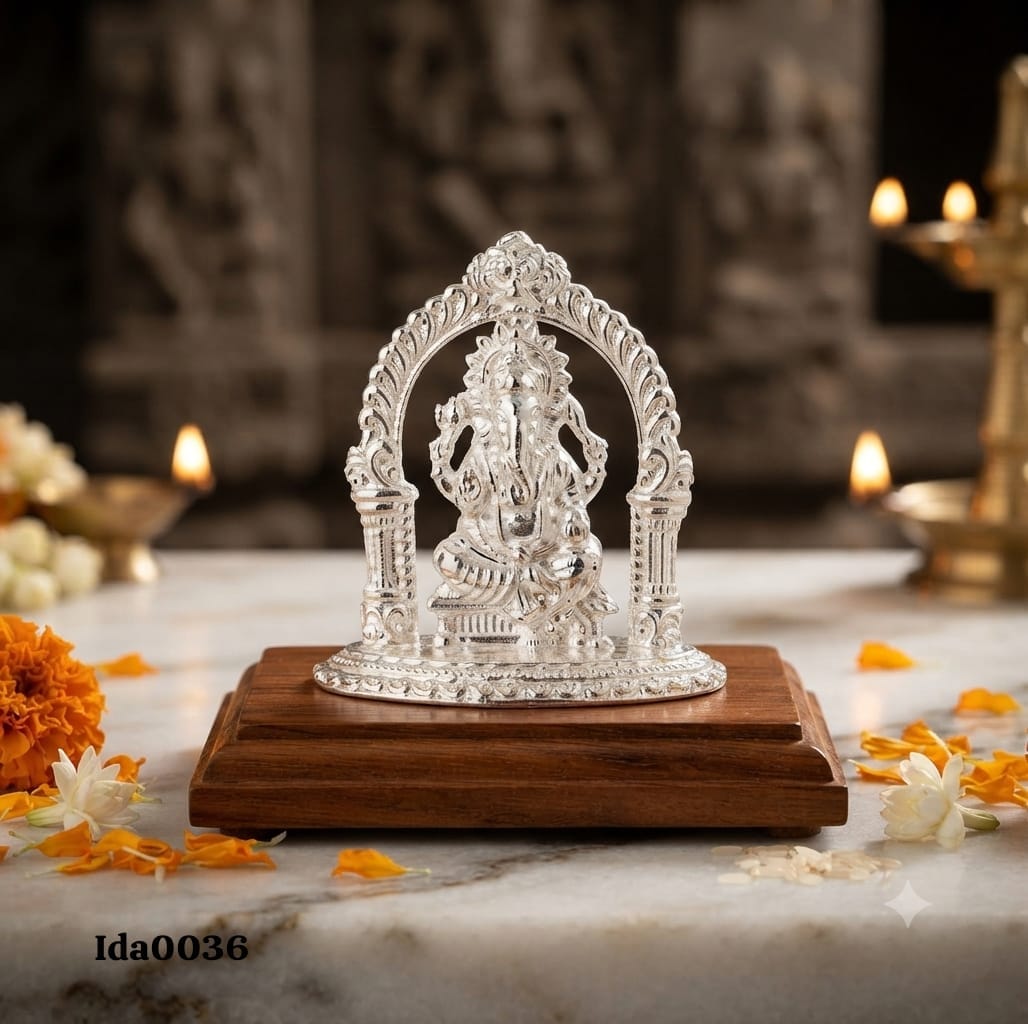 Lord Ganesha Idol seated under an ornate arch