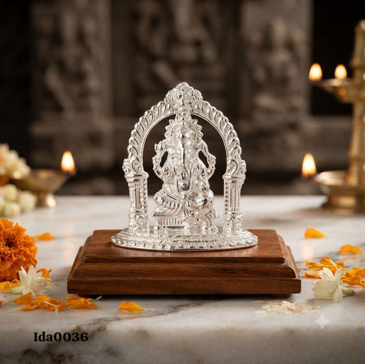 Lord Ganesha Idol seated under an ornate arch