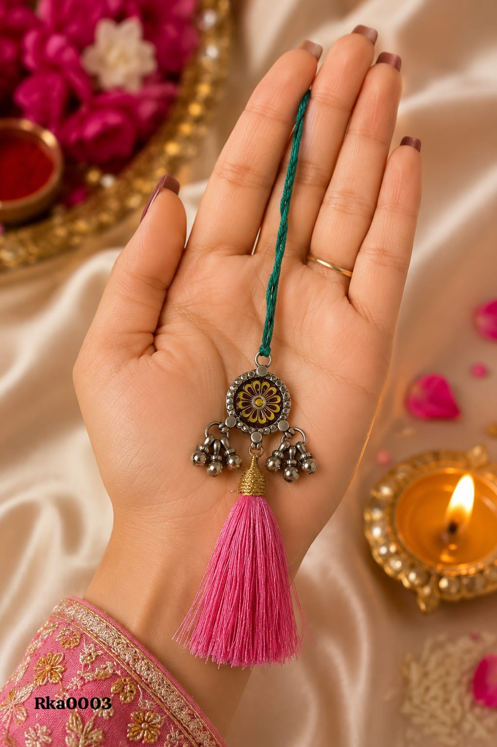 Floral Silver Rakhi with pink tassel