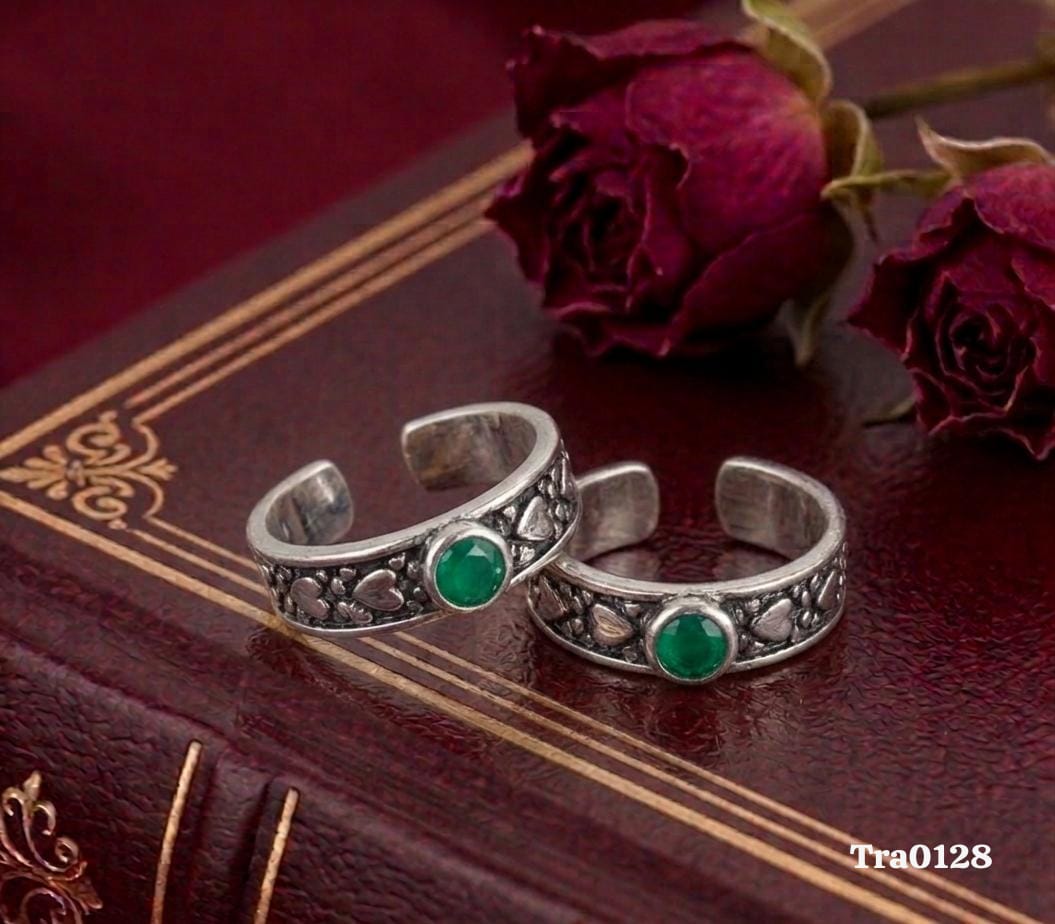 Oxidized band Silver Toe Rings with a decorative pattern and a central green stone