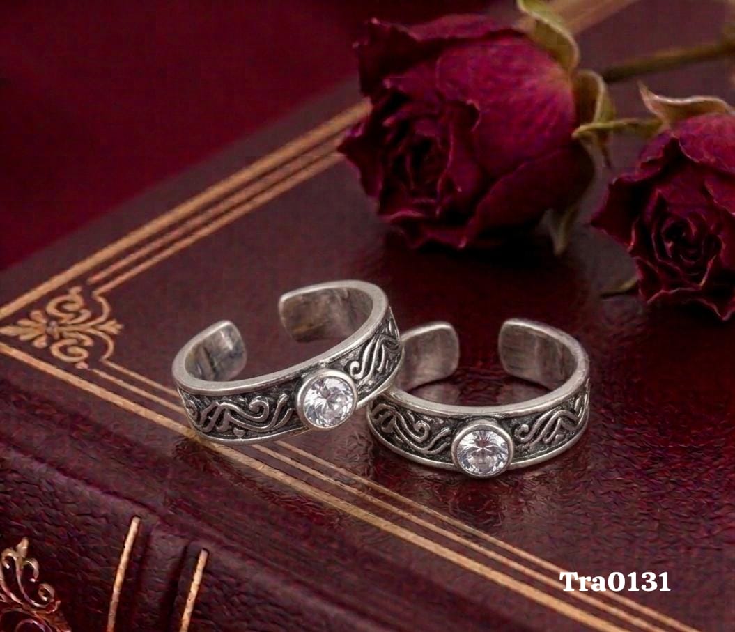 Oxidized band Silver Toe Rings with an intricate swirling pattern and a central clear stone