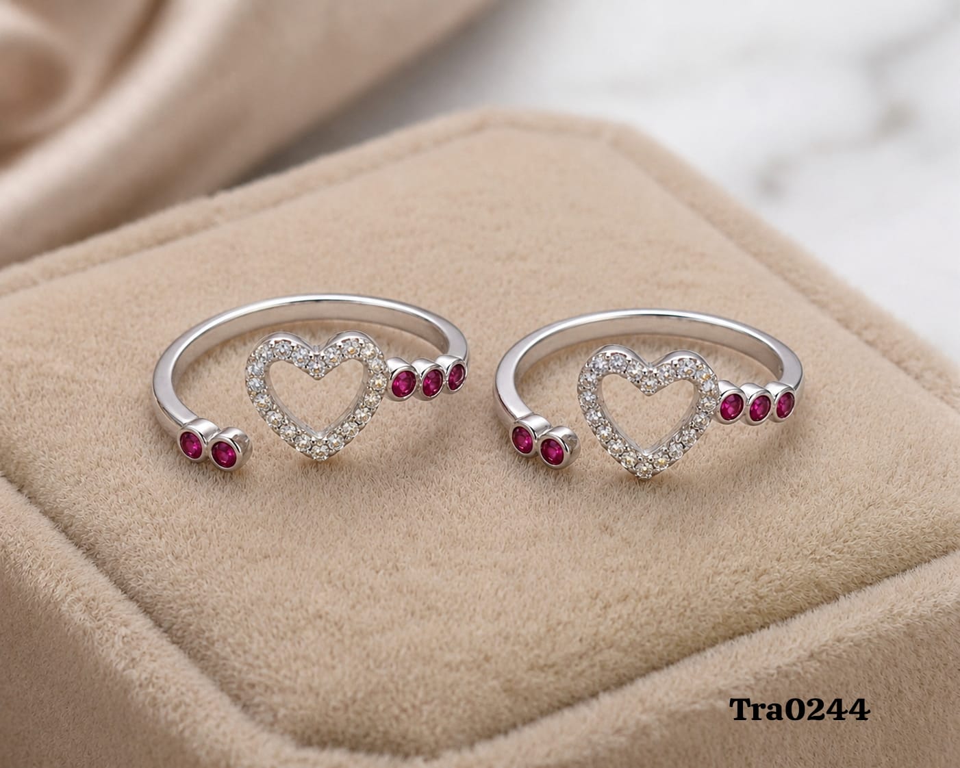 Heart-shaped centerpiece Silver Toe Rings with vibrant pink circular stones