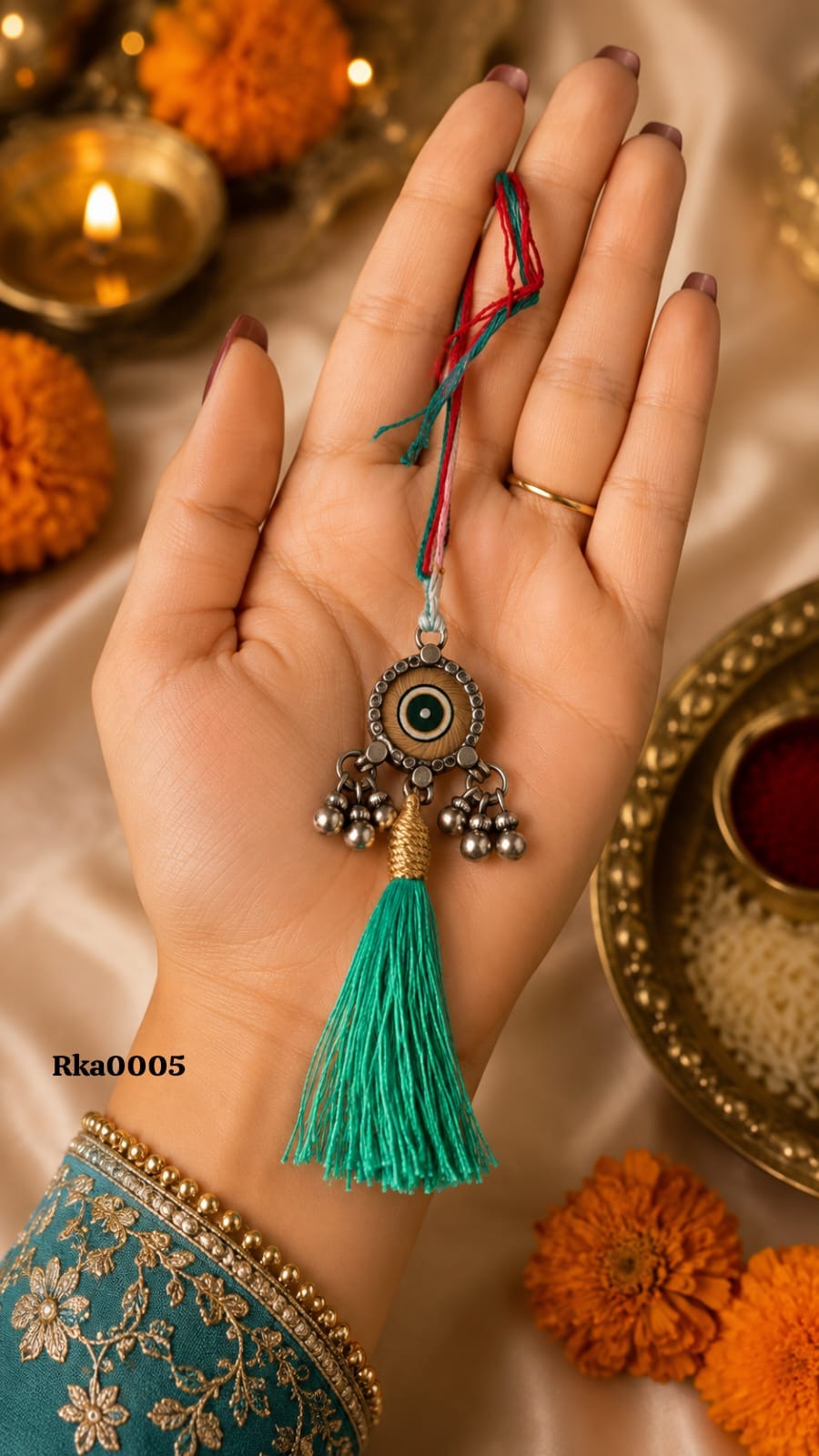 Evil Eye Silver Rakhi with green tassel