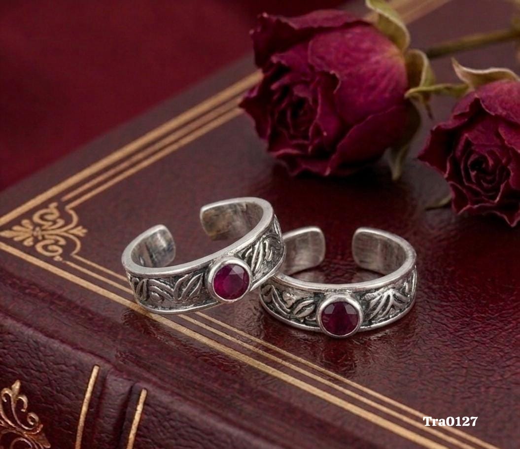 Oxidized band Silver Toe Rings with an intricate leaf-style pattern and a central reddish-pink stone