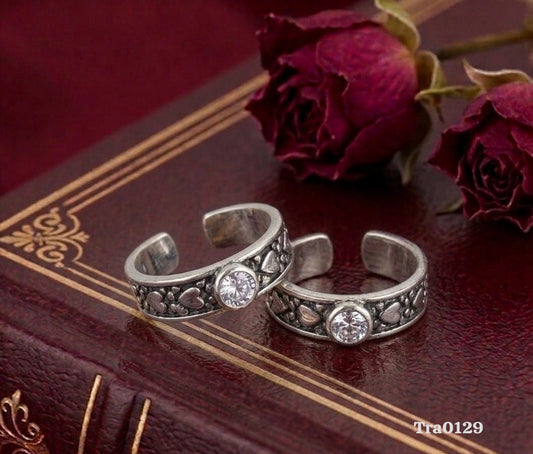 Oxidized band Silver Toe Rings with a decorative pattern and a central clear stone