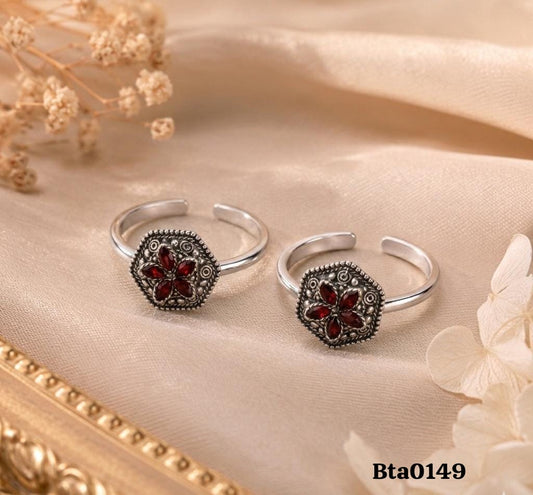 An ornate, hexagonal-shaped Silver Toe Rings