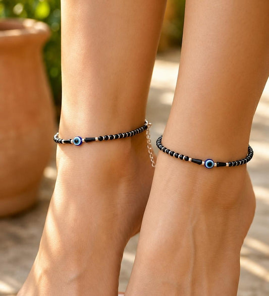 Anklet with black beads and single evil eye bead